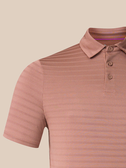 Close-up of a short-sleeve polo shirt in a dusty rose pink color with fine horizontal stripes, featuring a three-button placket and a classic collar.