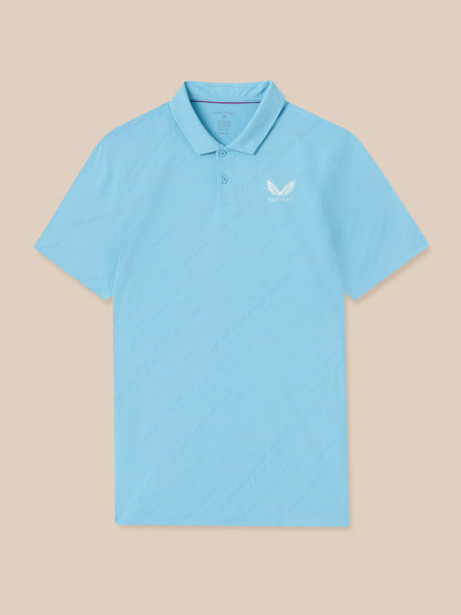 Light blue polo shirt with a small logo on a beige background