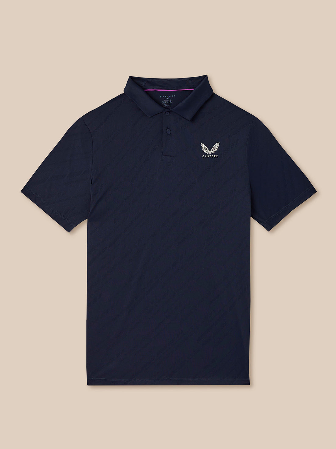 Navy polo shirt with a logo on a beige background