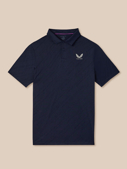 Navy polo shirt with a logo on a beige background