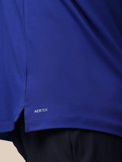 Close-up of a blue garment with 'AERTEK' branding on a neutral background