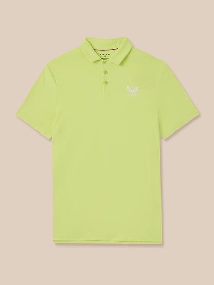 Light green polo shirt with a small Castore logo on a beige background