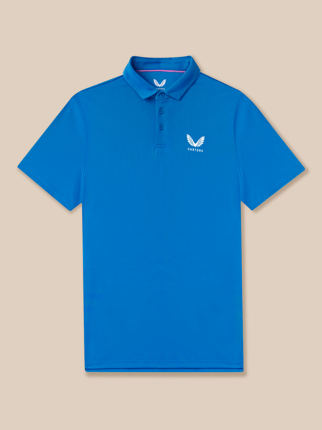Blue polo shirt with a logo on a beige background
