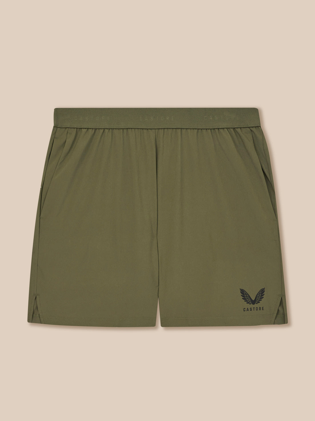 Green shorts with a logo on a beige background