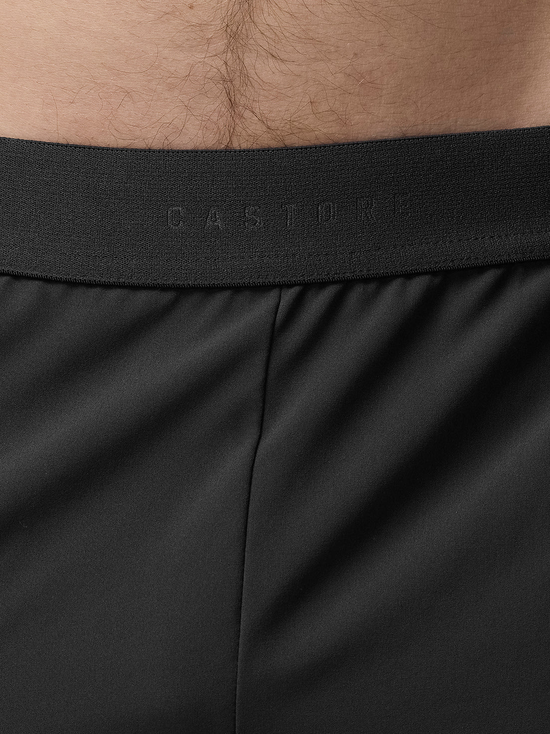 Close-up of black underwear with brand logo on waistband