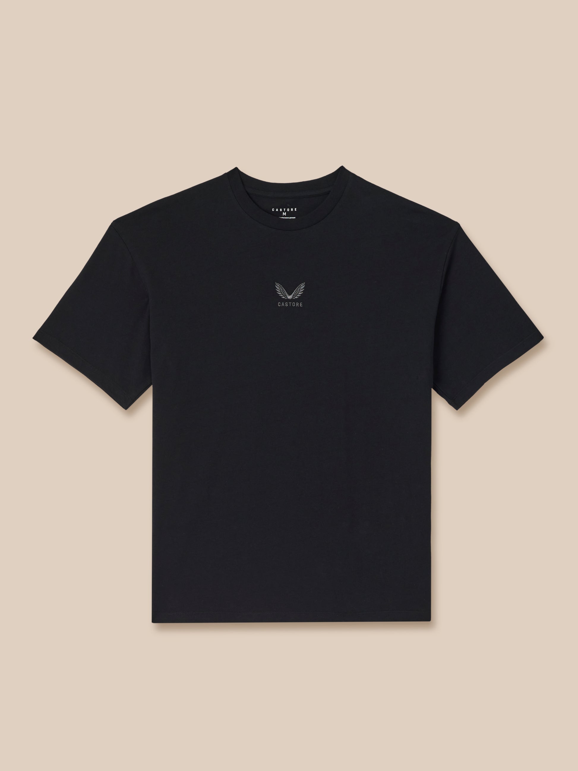 Black t-shirt with a small logo on a beige background