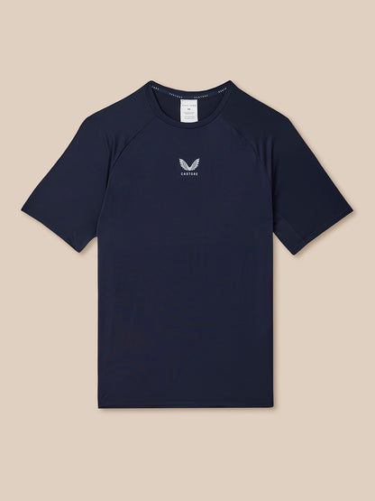Navy blue t-shirt with a logo on a beige background