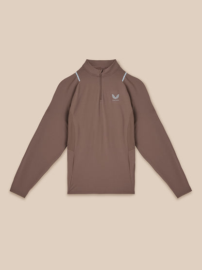 Brown long-sleeve shirt with a logo on a beige background