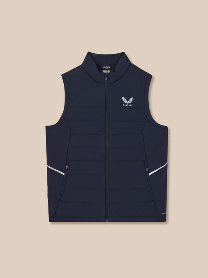 Navy puffer vest with a brand logo on a beige background