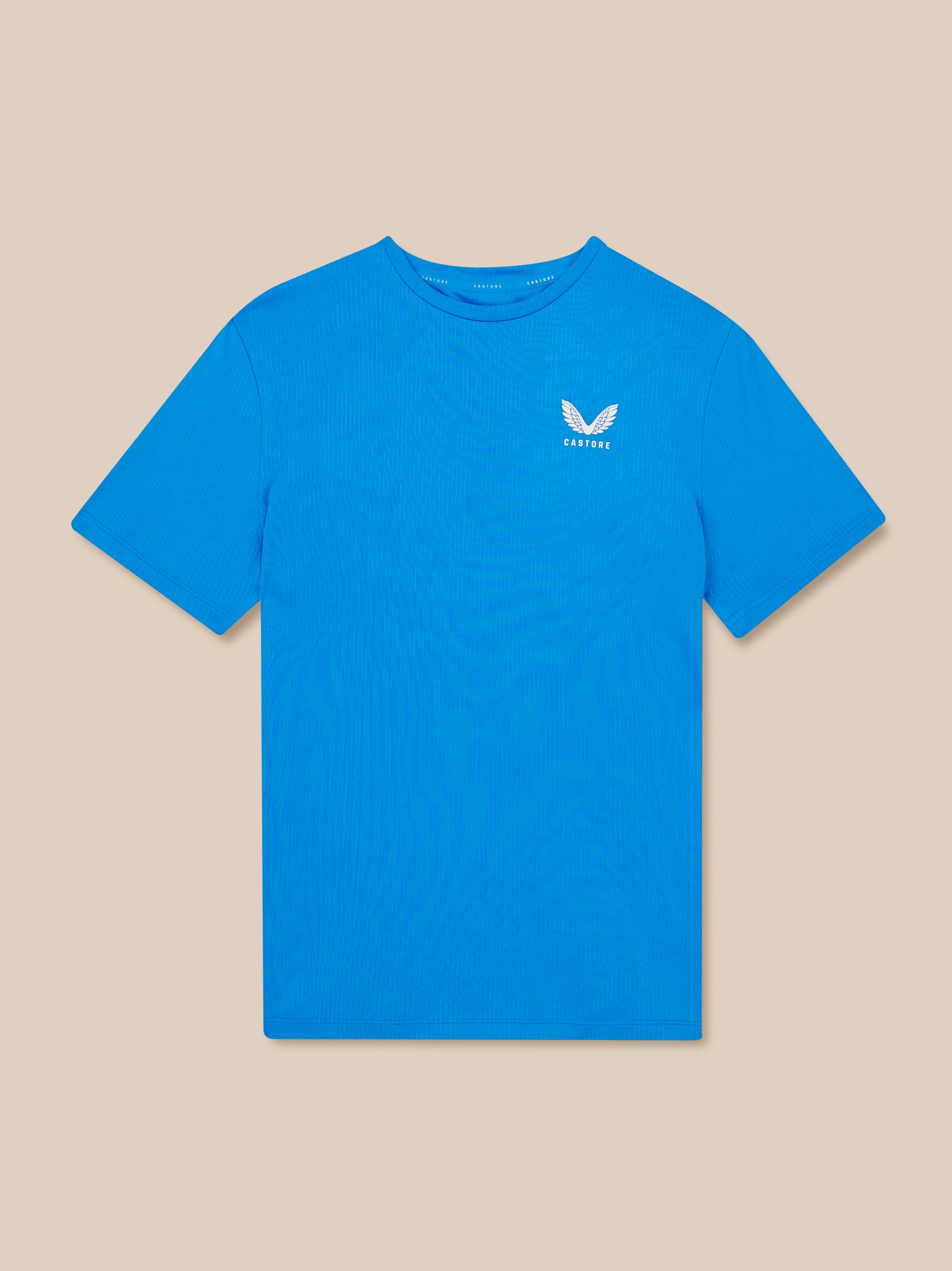 Blue t-shirt with a logo on a beige background