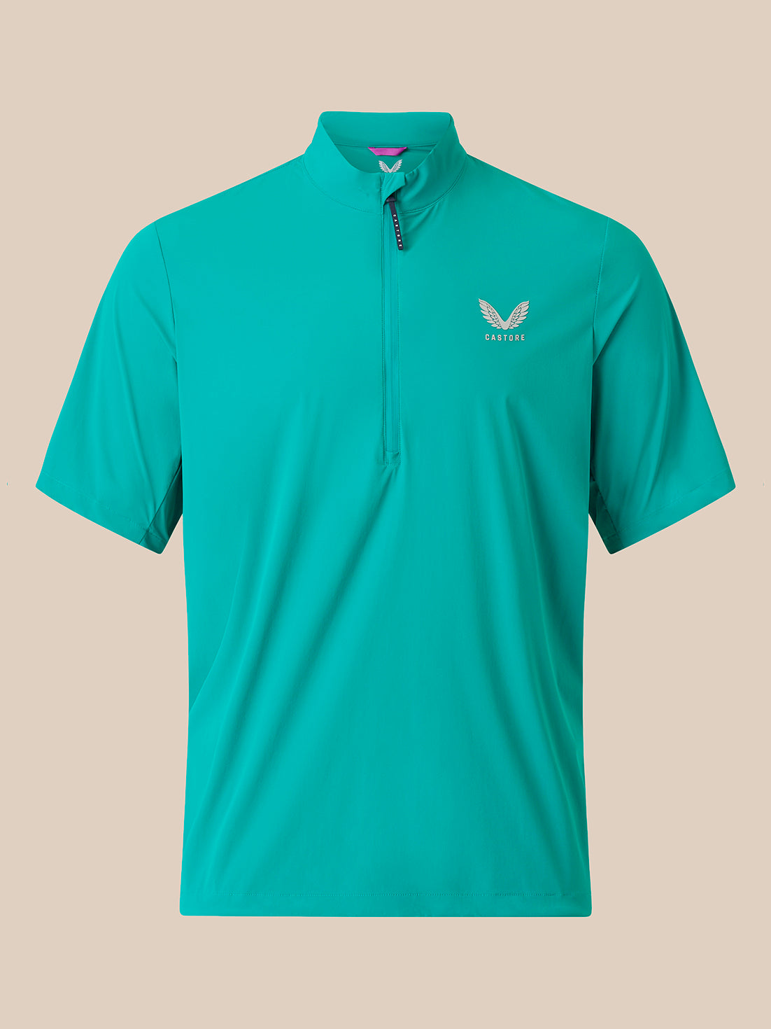 A short-sleeve athletic quarter-zip pullover in a vibrant turquoise/teal color, featuring a small white wing logo and the brand name 'CASTORE' on the left chest, displayed against a solid beige background.