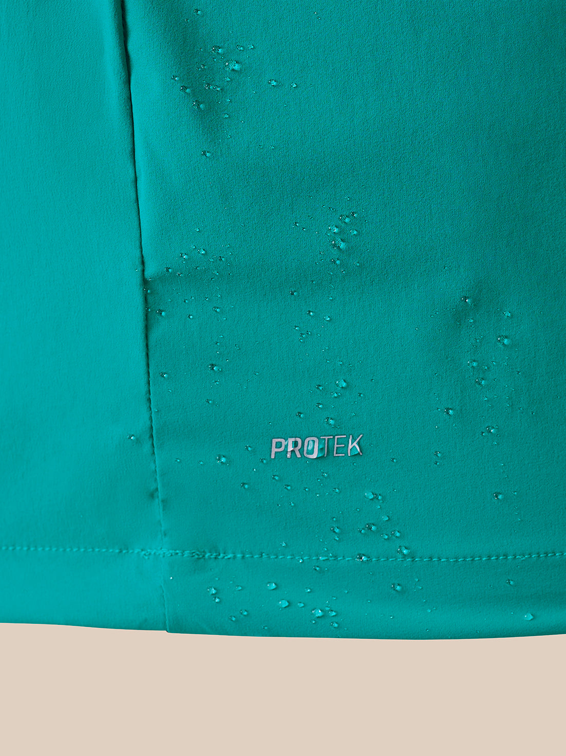 Close up image of a garment showing PROTEK logo