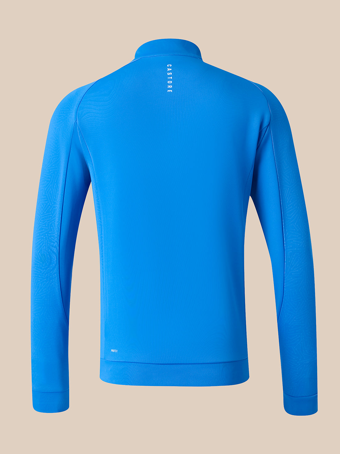 A bright blue long-sleeve quarter-zip athletic top shown from the back, featuring a small vertical white logo on the upper back and subtle textured paneling on the sleeves, set against a solid beige background.