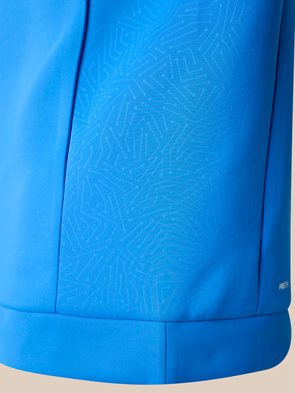 Close-up of a bright blue quarter zip, showing a subtle geometric pattern on the front panel and a ribbed cuff.