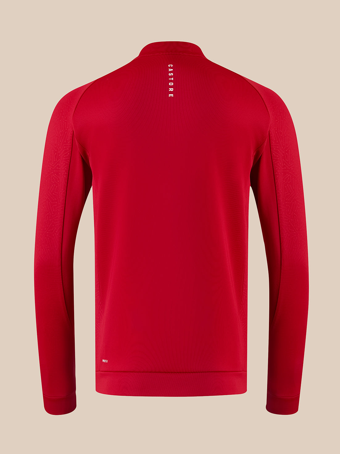 A red long-sleeve athletic quarter-zip pullover shown from the back, featuring a vertical white 'CASTORE' logo on the upper back, set against a solid beige background.