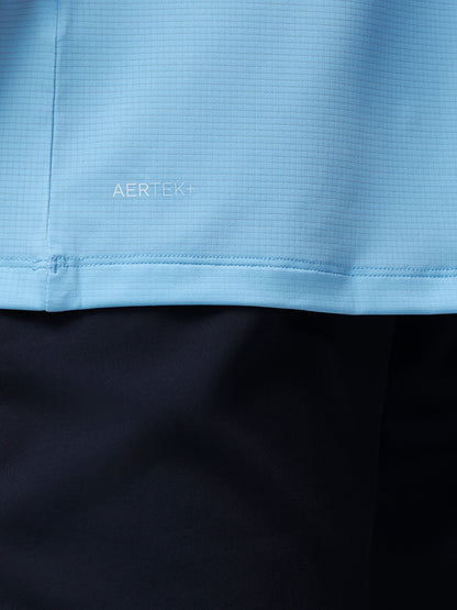 Close-up of a blue fabric with 'AERTEK' branding on a black background