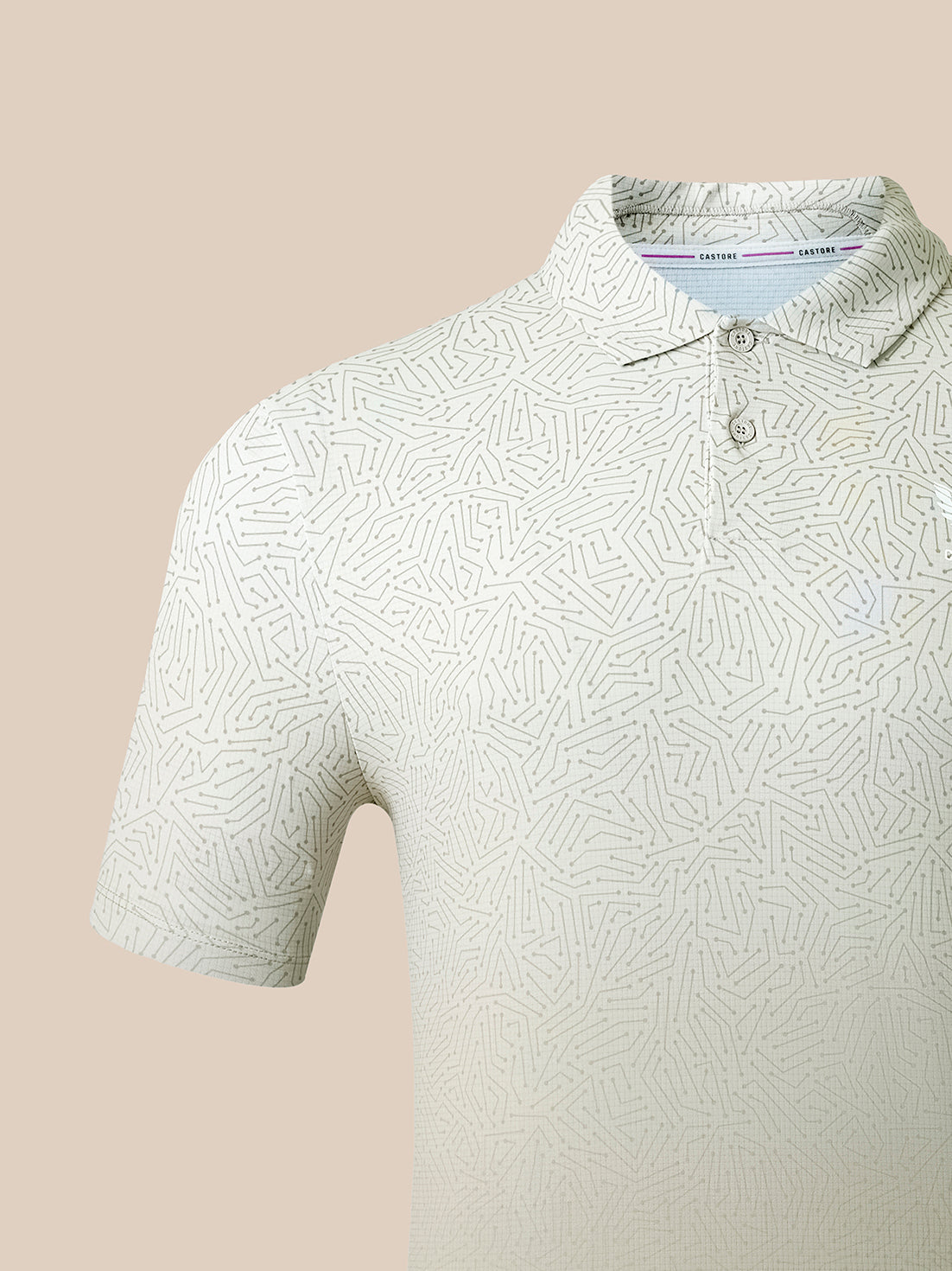 A close-up of a short-sleeve polo shirt with a light beige and white geometric maze-like pattern, featuring a two-button placket and a classic collar.