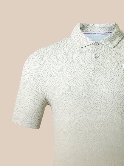 A close-up of a short-sleeve polo shirt with a light beige and white geometric maze-like pattern, featuring a two-button placket and a classic collar.