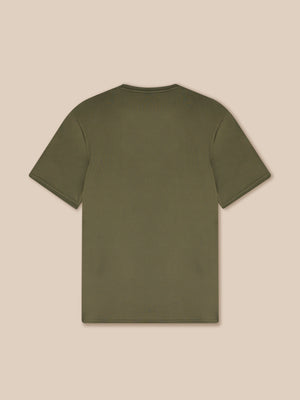 Green t-shirt on a beige background