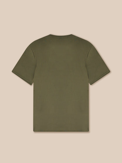 Green t-shirt on a beige background