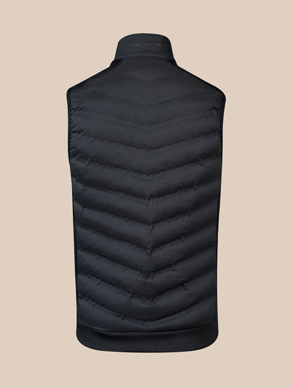 Back view of a black padded gilet with chevron quilting and stand collar