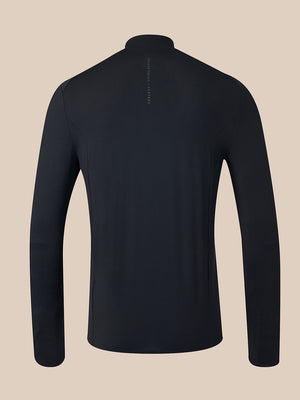 A black long-sleeve athletic quarter-zip pullover shown from the back, featuring a small vertical brand logo on the upper back, set against a solid beige background.