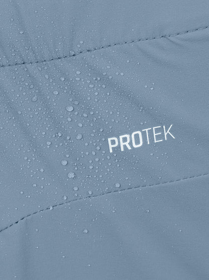 Close-up of a light blue-gray waterproof jacket with water droplets on the surface and the word PROTEK printed in white.