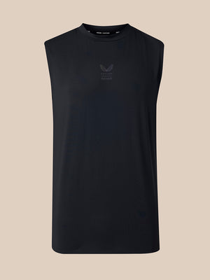 A sleeveless black athletic tank top with a subtle tonal chest logo, displayed on a solid beige background.