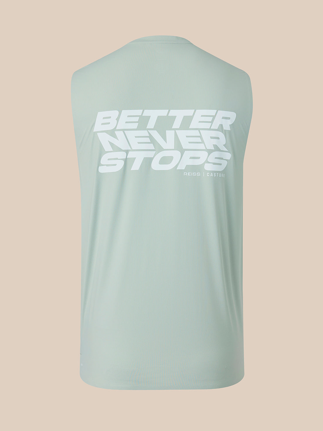 A sleeveless athletic tank top in a pale mint green color, shown from the back with a large white graphic text reading 'BETTER NEVER STOPS' on the upper back, set against a solid beige background.