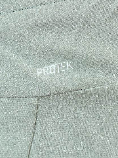 Close-up of sage mist fabric displaying ProTek branding and water droplets