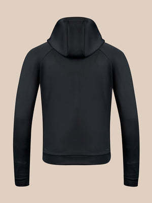 A black hooded sweatshirt shown from the back, featuring raglan sleeves and a ribbed hem and cuffs, displayed on a solid beige background.
