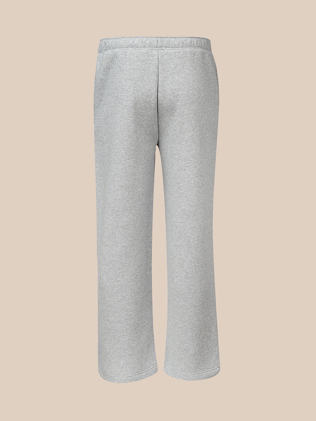 Back view of light grey fleece joggers with a wide leg silhouette
