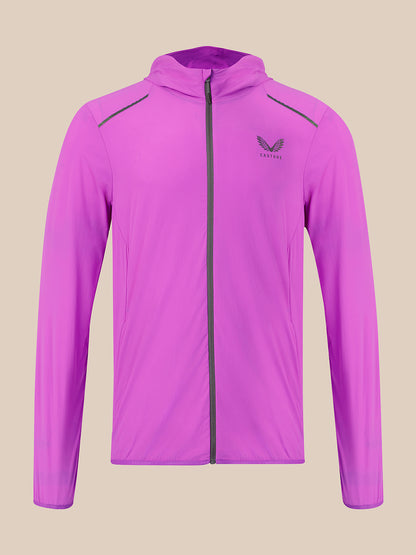 A purple hooded athletic jacket with a full front zipper, zippered shoulder pockets, and a dark gray wing logo on the left chest, displayed against a solid beige background.