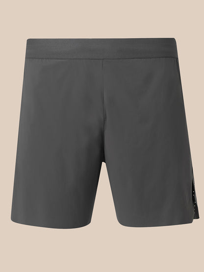 Dark gray athletic shorts with a wide waistband, shown from the back on a solid beige background.