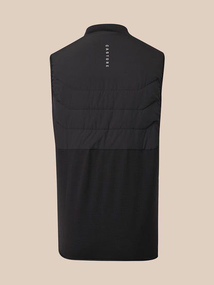 Black sleeveless quilted vest shown from the back, featuring horizontal quilting and a small vertical white 'CASTORE' logo near the collar, set against a solid beige background.