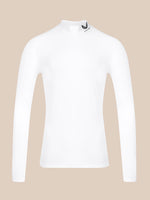 A white long-sleeve mock neck athletic top with a small black logo on the collar, displayed on a solid beige background.