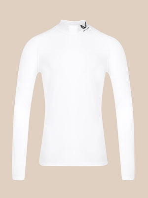 A white long-sleeve mock neck athletic top with a small black logo on the collar, displayed on a solid beige background.