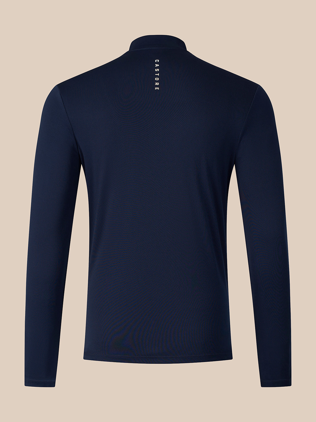 A navy blue long-sleeve quarter-zip pullover shown from the back, featuring a small vertical white 'CASTORE' logo printed on the upper back, set against a solid beige background.