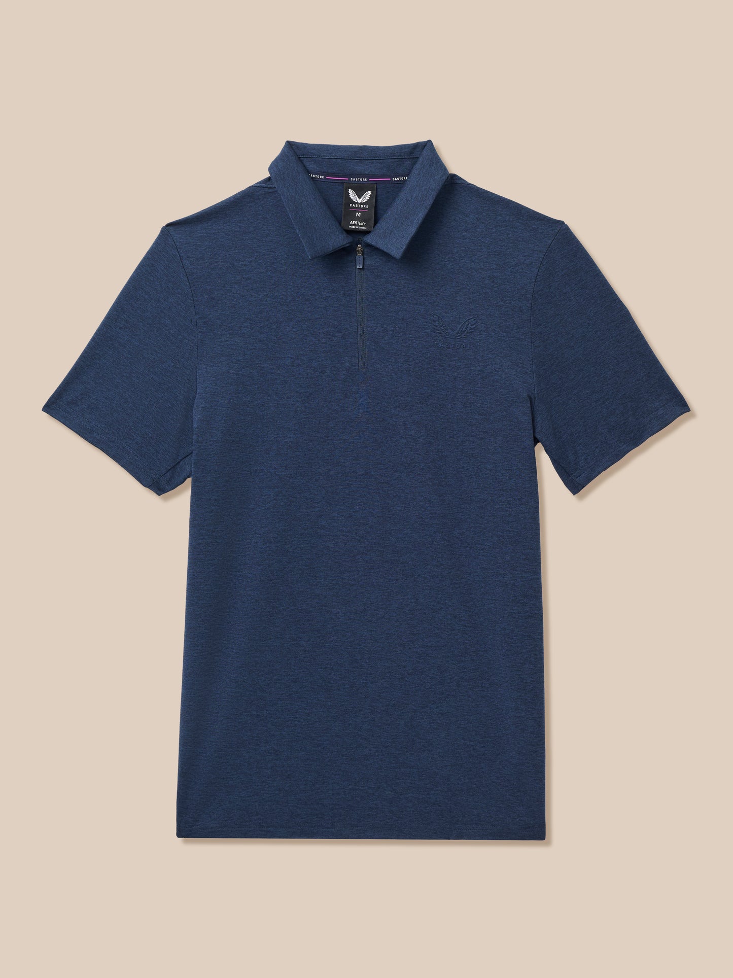 A navy blue short-sleeve polo shirt with a half-zip collar, displayed flat against a solid beige background.