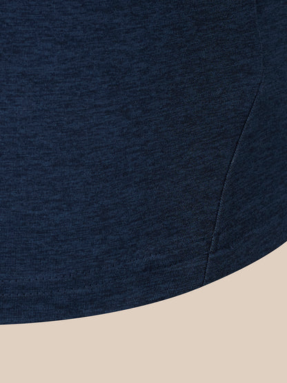 Close-up of a dark navy heathered fabric garment corner with a curved hem, shown against a light beige background.