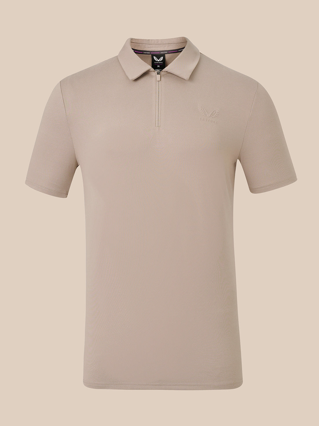 A short-sleeve polo shirt with a half-zip collar in a light taupe-beige color, shown against a solid beige background.