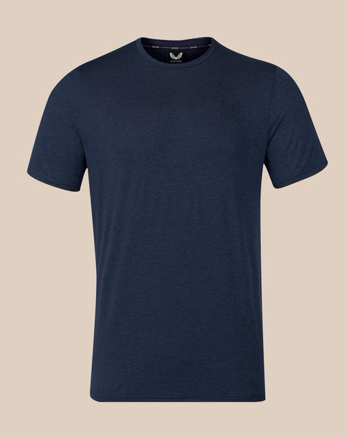 A navy blue short-sleeve crewneck t-shirt displayed on a solid beige background.