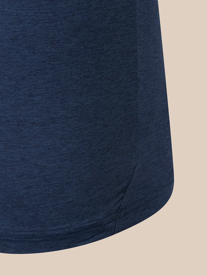 Close-up of a navy blue heathered fabric garment, showing the texture and hem against a solid beige background.