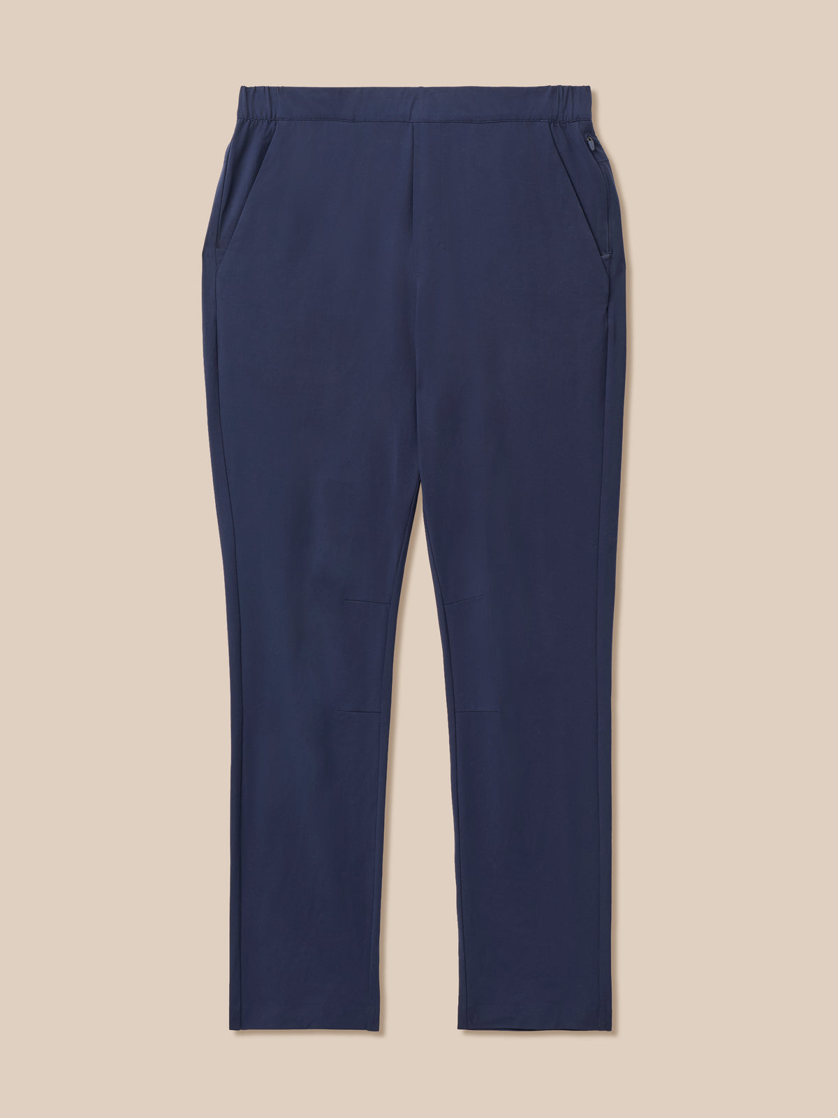 A pair of navy blue trousers with a flat front, side pockets, and a straight leg, displayed flat against a solid beige background.