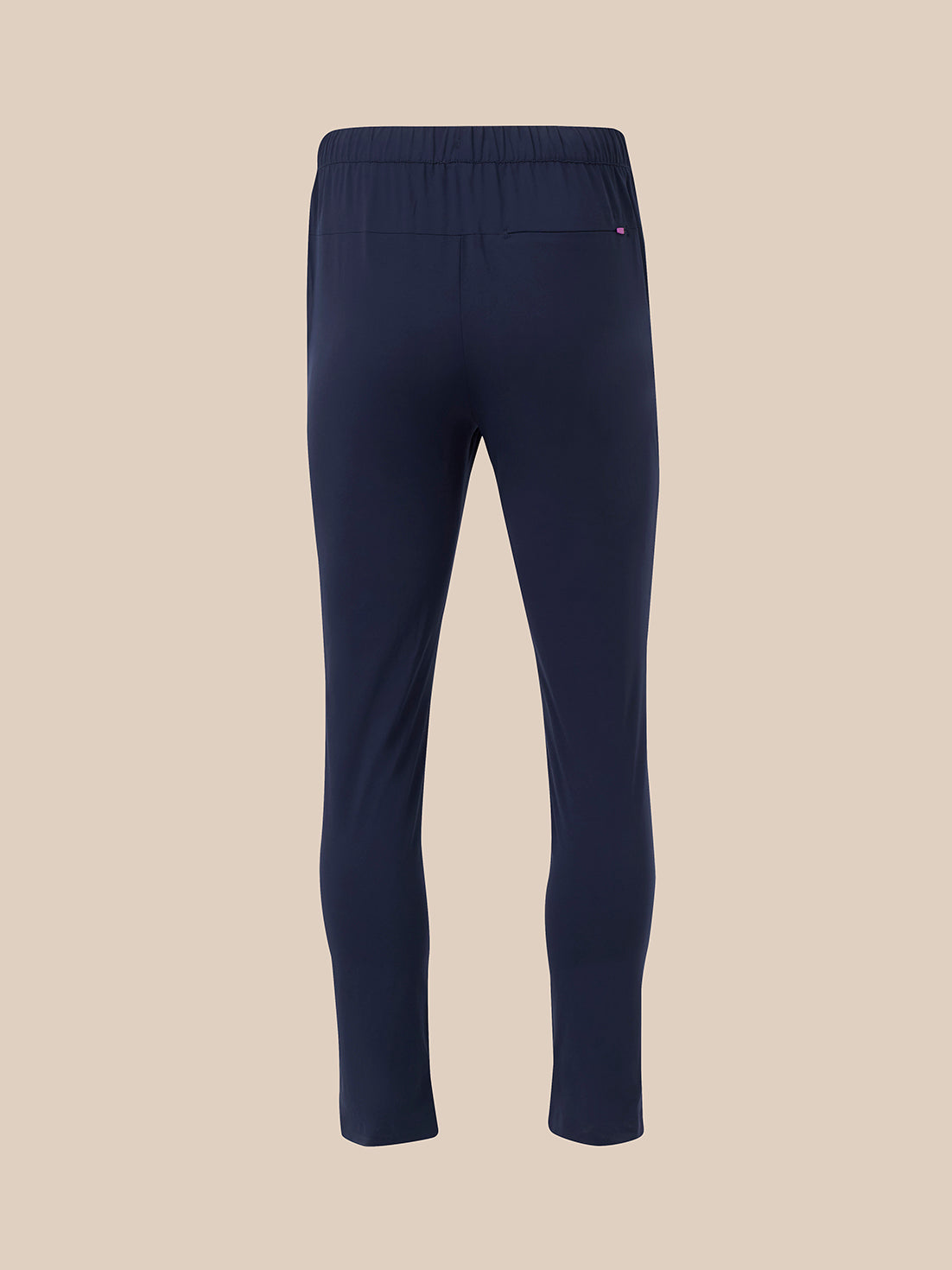 Back view of navy slim fit trousers showing a pink zip pull on the rear pocket
