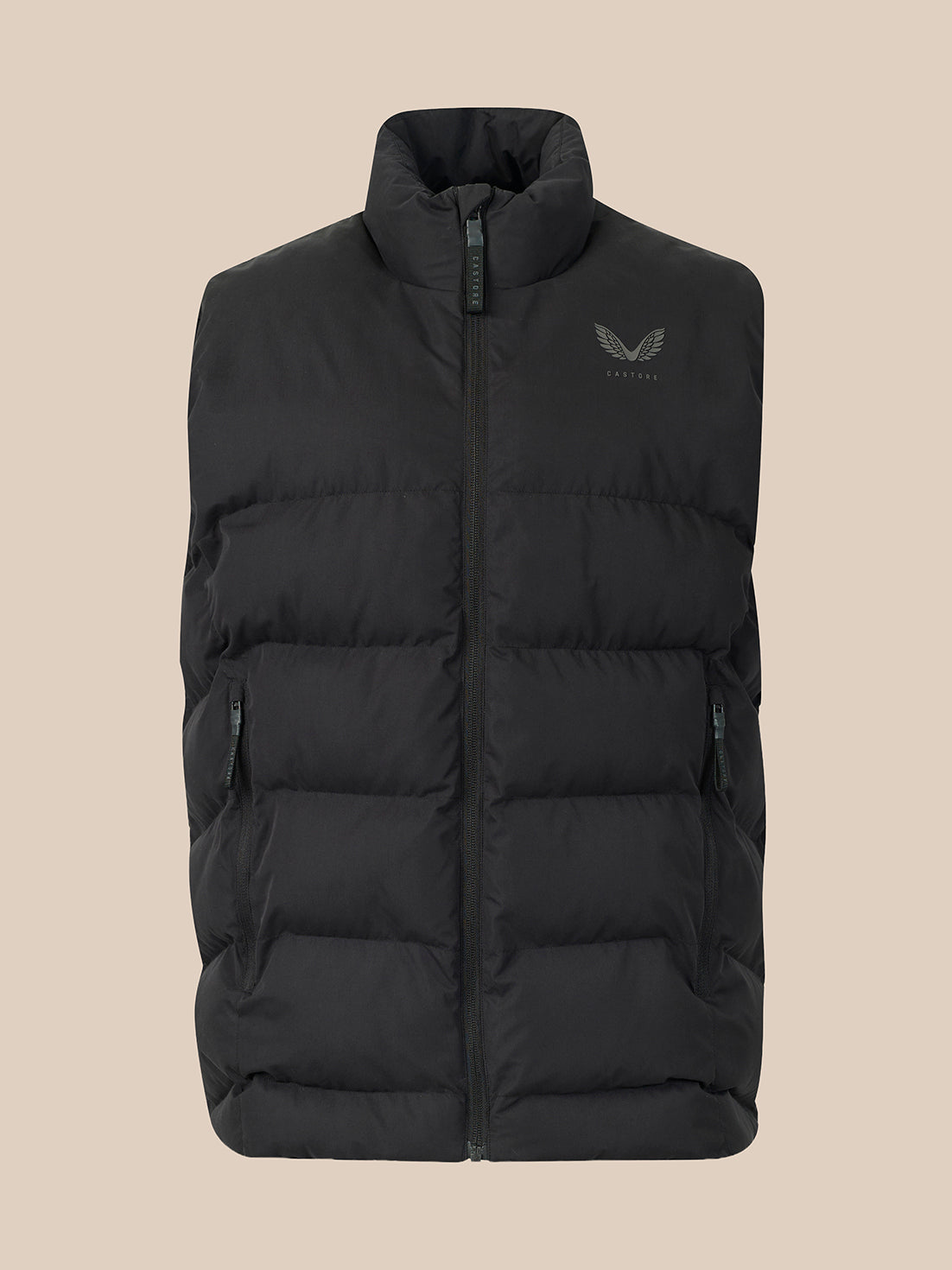 A black puffer vest with a stand-up collar and a small dark gray wing logo on the left chest, displayed against a solid beige background.