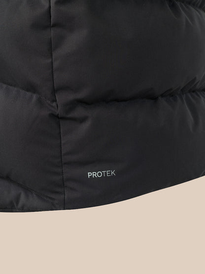 Close-up of a black puffer jacket with horizontal quilting and a small white 'PROTEK' logo near the bottom, set against a light beige background.