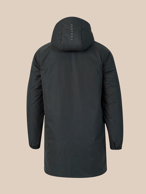 A dark gray hooded jacket shown from the back, featuring a vertical 'CASTORE' logo printed on the back of the hood, set against a solid beige background.