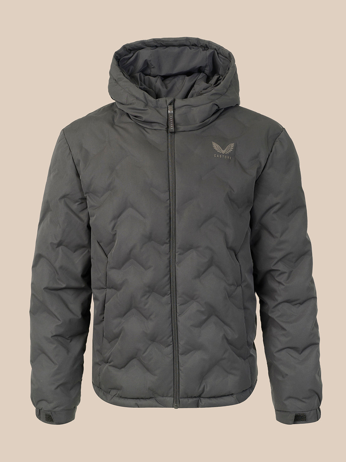 A black hooded puffer jacket with a full-zip front and a small gray wing logo on the left chest, displayed against a solid beige background.