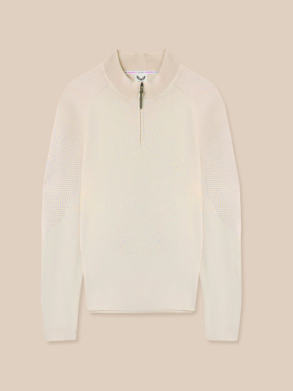 White textured sweater with a zipper on a beige background